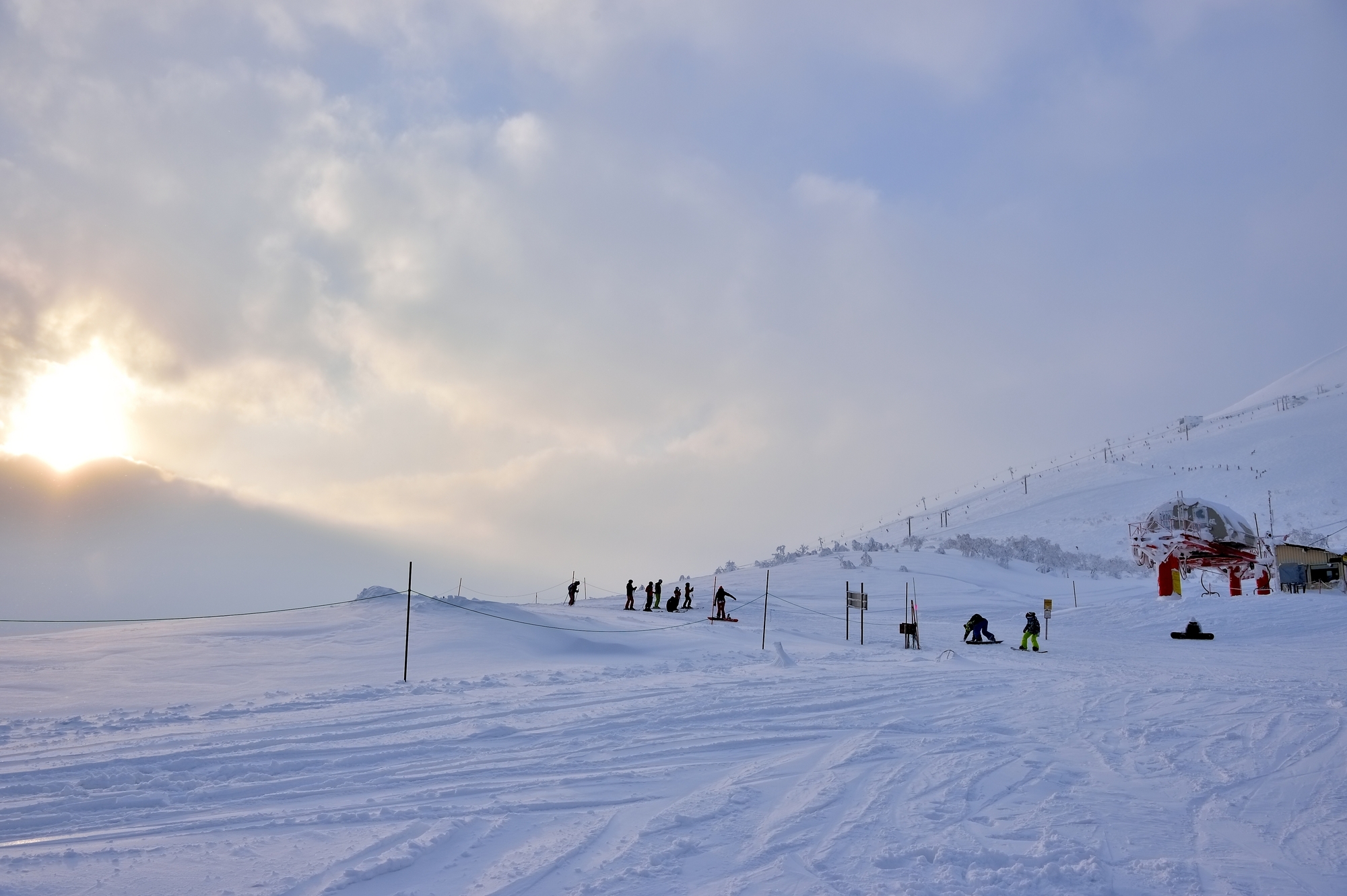 Niseko's snowy mountains and Mt. Yotei at sunset