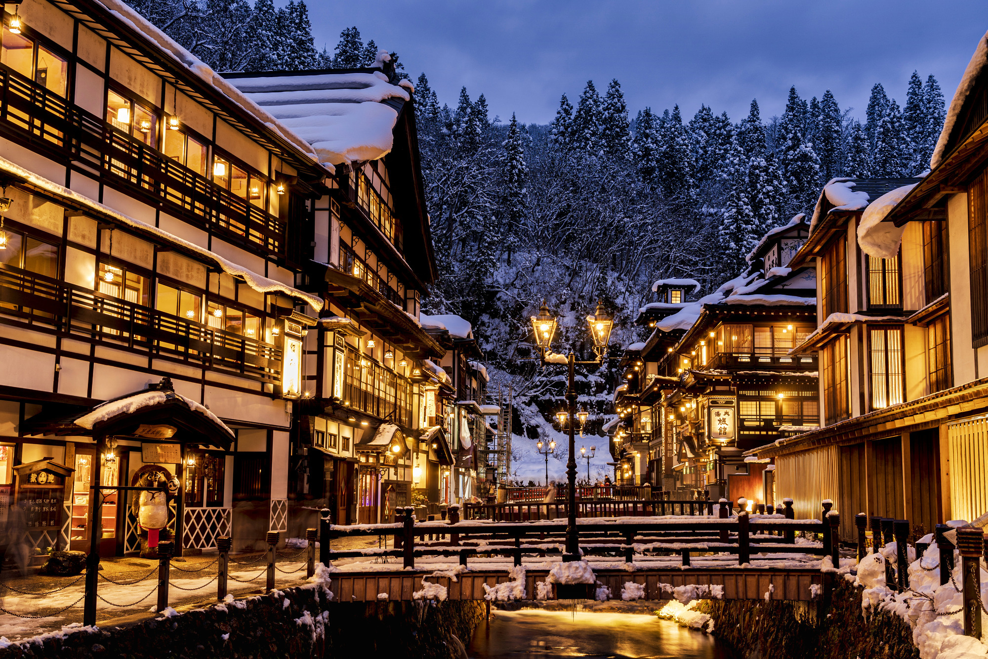 Night view of Ginzan Onsen with gas lamps in the snow