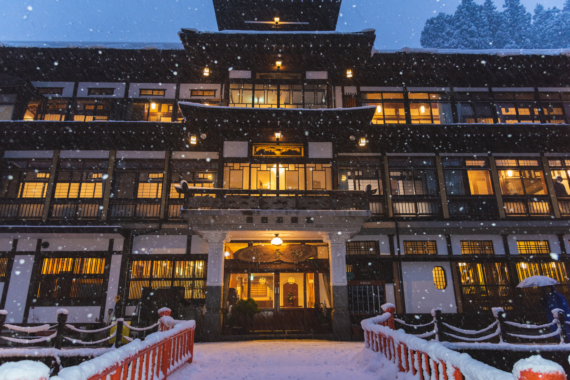 A red bridge in snowy Ginzan Onsen